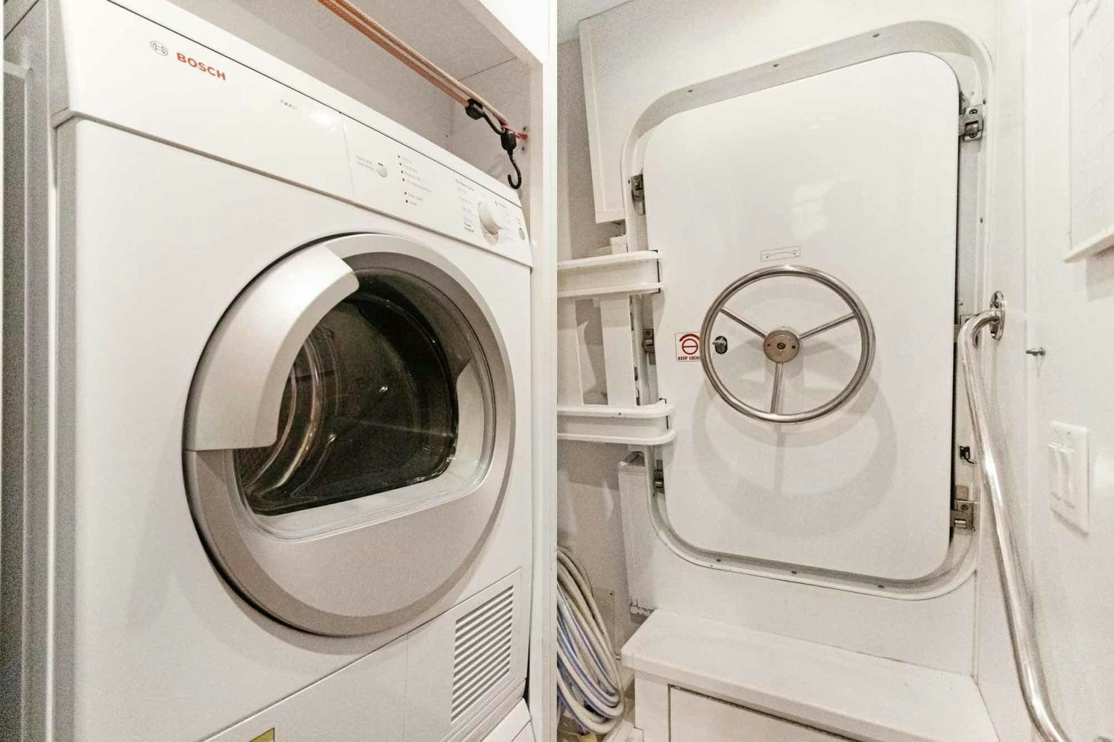 a white washing machine aboard SEMPER FI Yacht for Sale