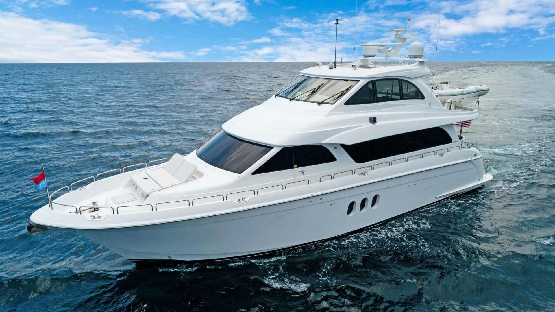 a white yacht in the water aboard SEMPER FI Yacht for Sale