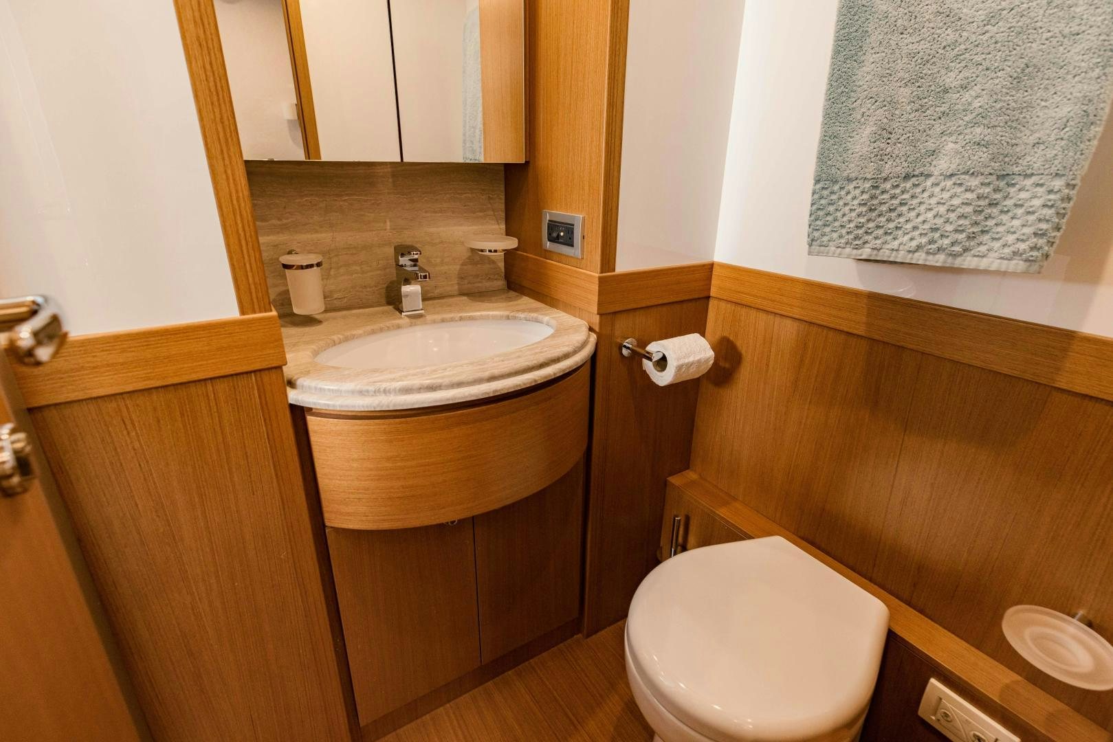 a bathroom with a sink and a toilet aboard SHE RUNS WET Yacht for Sale