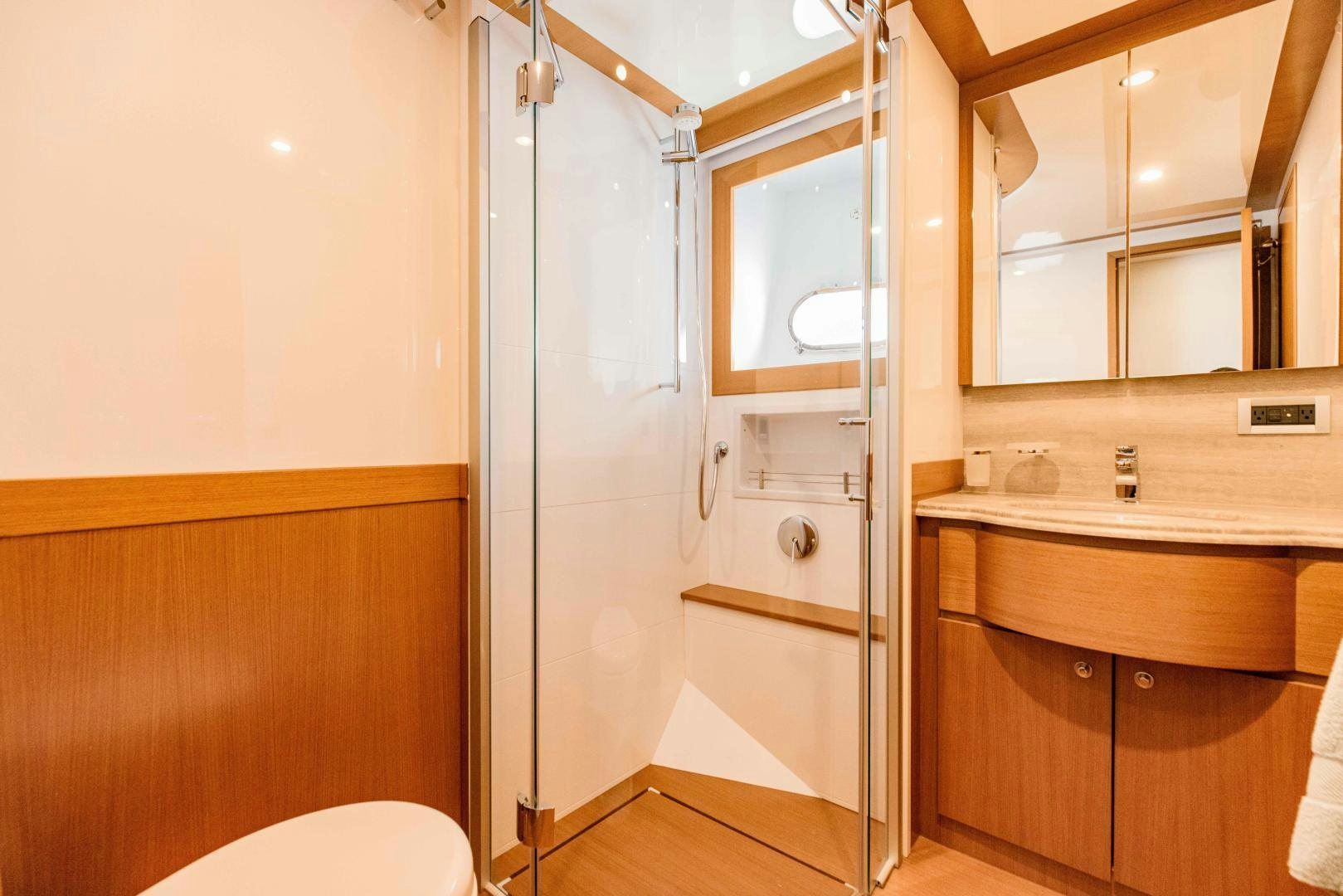 a bathroom with a shower unit aboard SHE RUNS WET Yacht for Sale