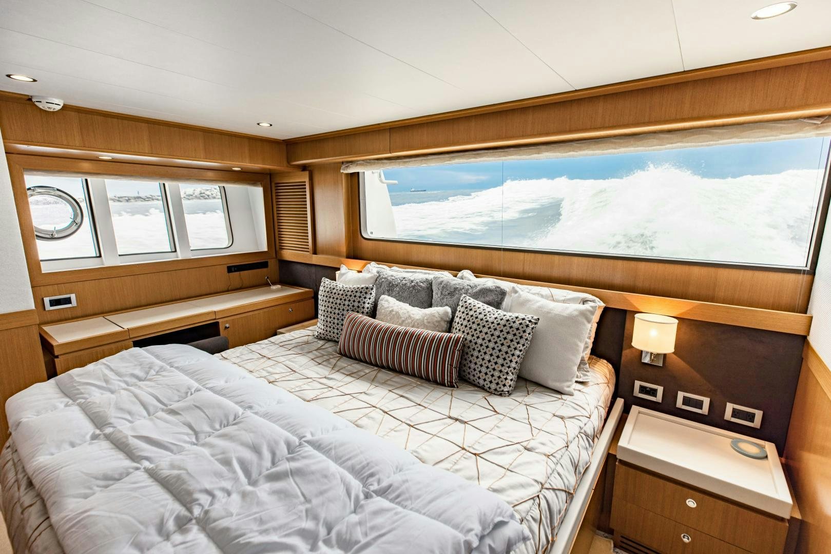 a bed with a large bed aboard SHE RUNS WET Yacht for Sale