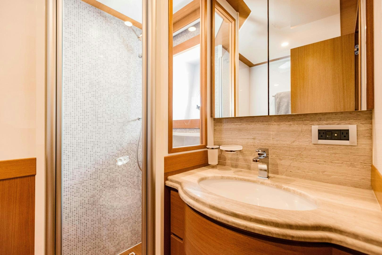 a bathroom with a sink and a mirror aboard SHE RUNS WET Yacht for Sale