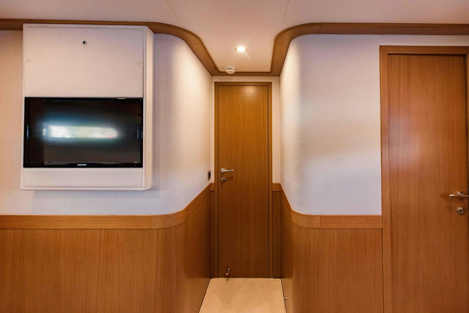 a tv on a wall aboard SHE RUNS WET Yacht for Sale