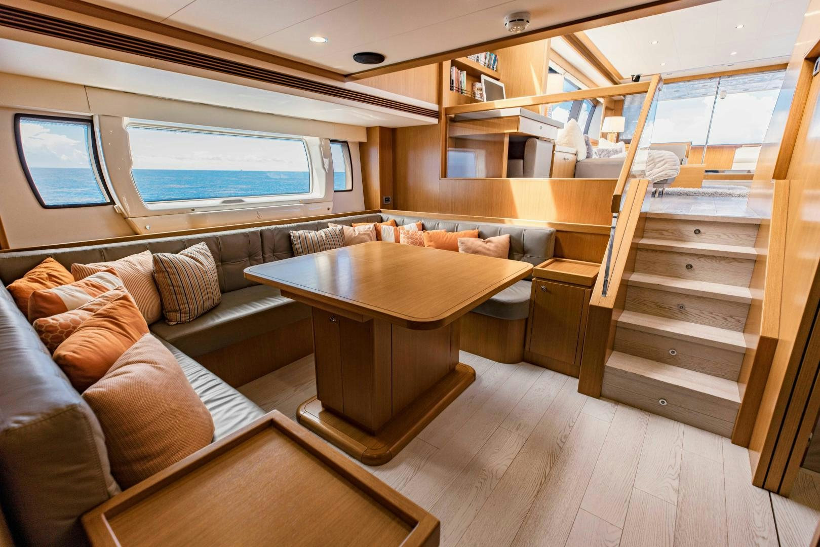 a room with a couch and a table aboard SHE RUNS WET Yacht for Sale