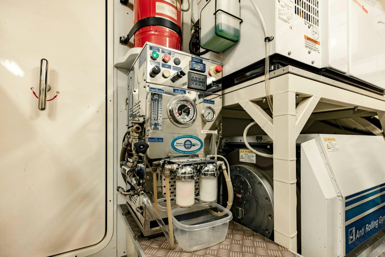 a machine with a red bucket aboard SHE RUNS WET Yacht for Sale