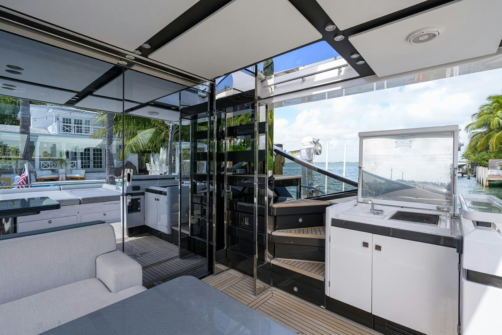 a room with a glass wall and a large window aboard CRIMSON Yacht for Sale