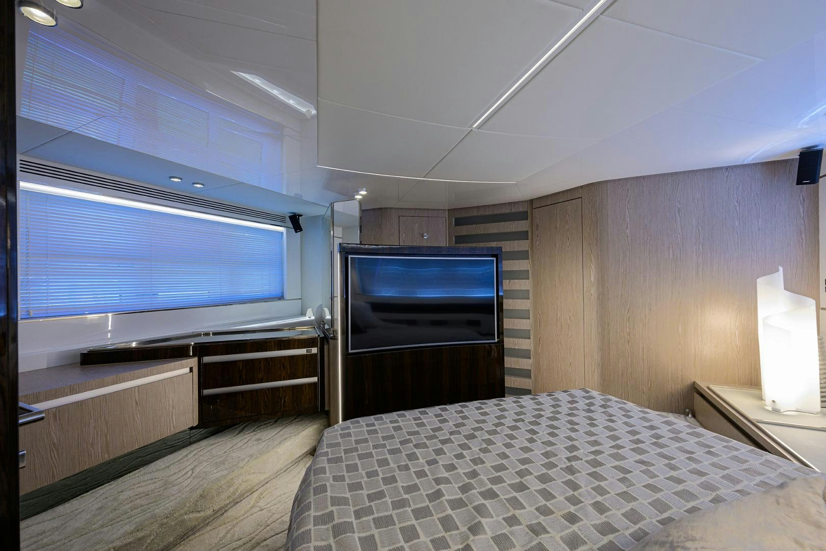 a room with a bed and a tv aboard CRIMSON Yacht for Sale