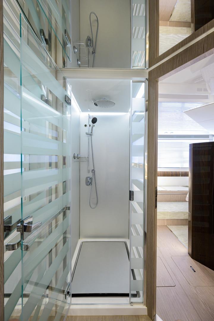 a large white cabinet with doors aboard CRIMSON Yacht for Sale