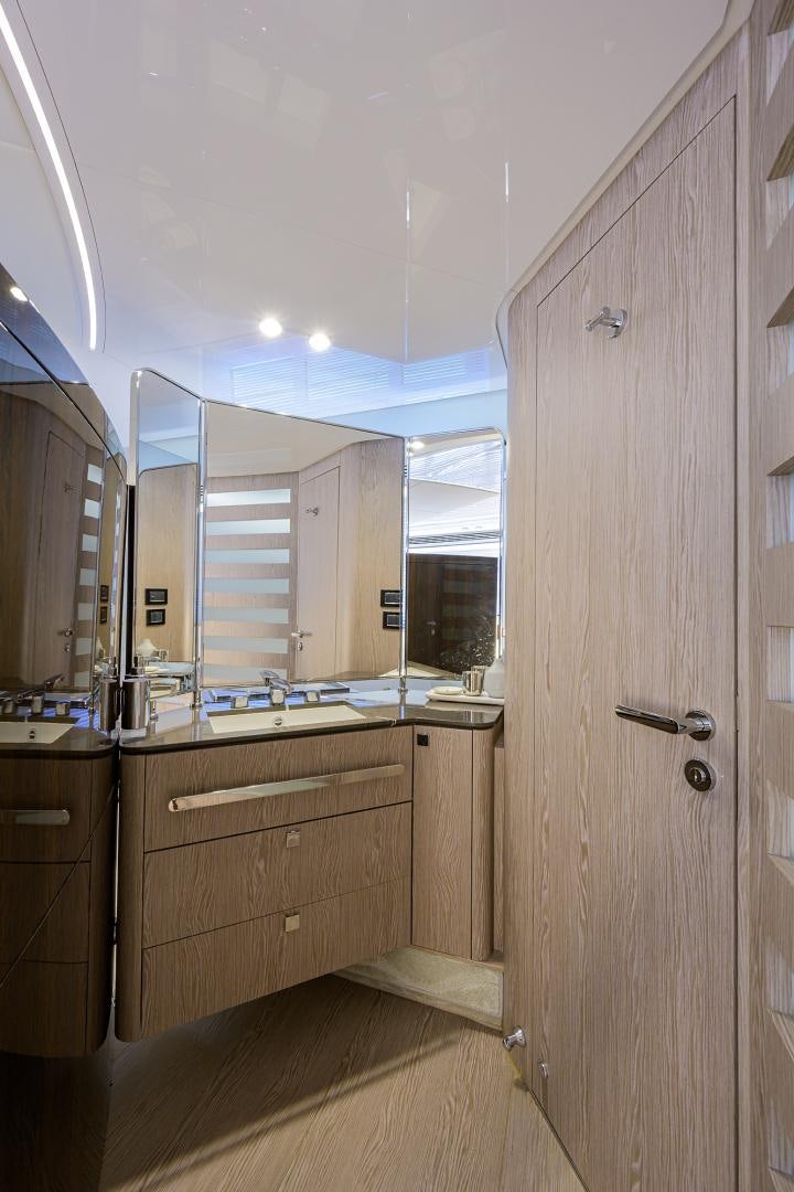 a bathroom with a large mirror aboard CRIMSON Yacht for Sale