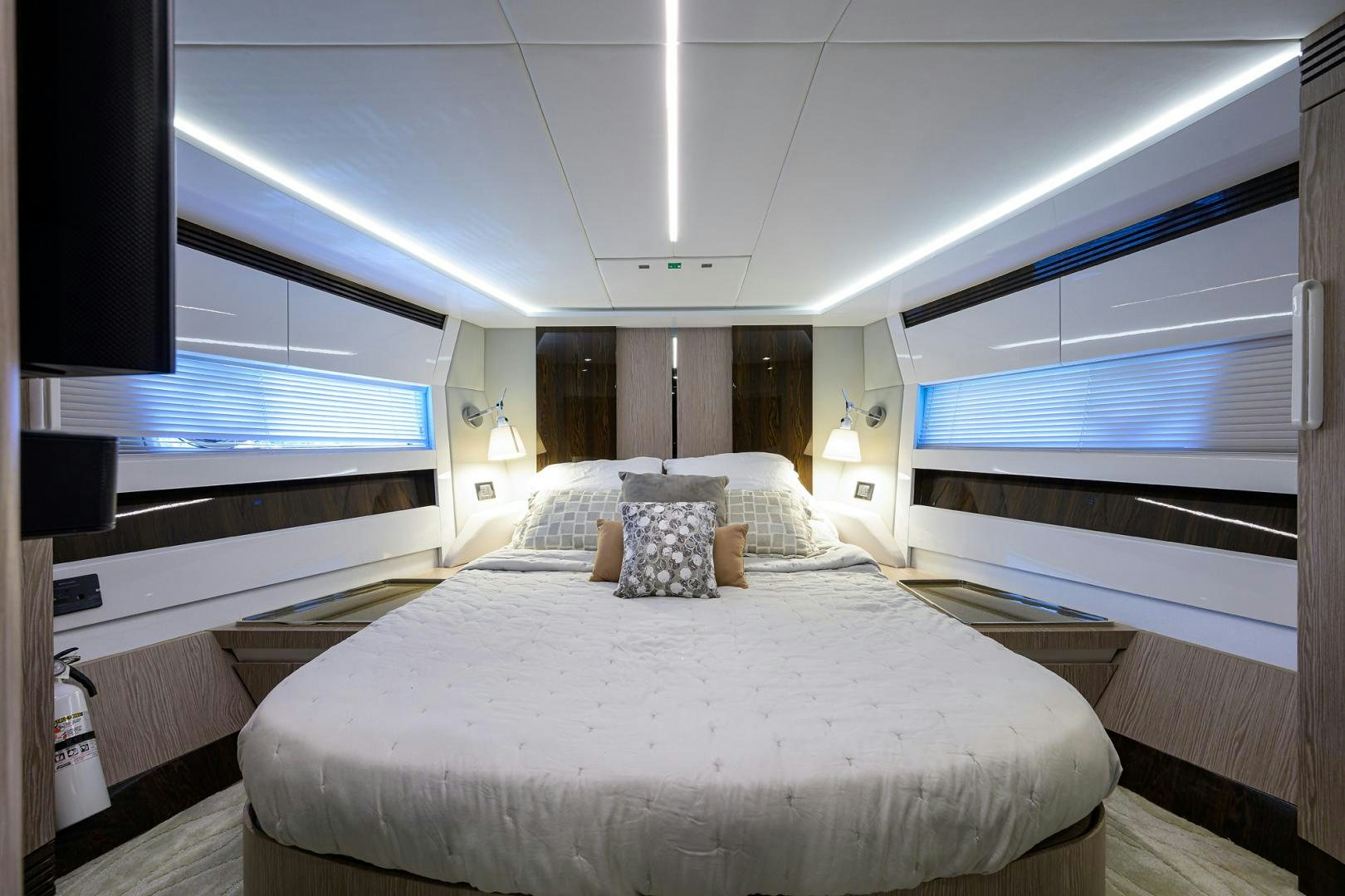a large bed in a room aboard CRIMSON Yacht for Sale