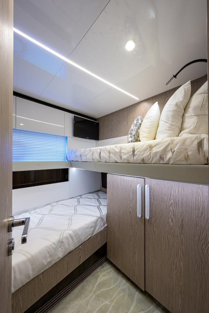 a room with a bed and a window aboard CRIMSON Yacht for Sale