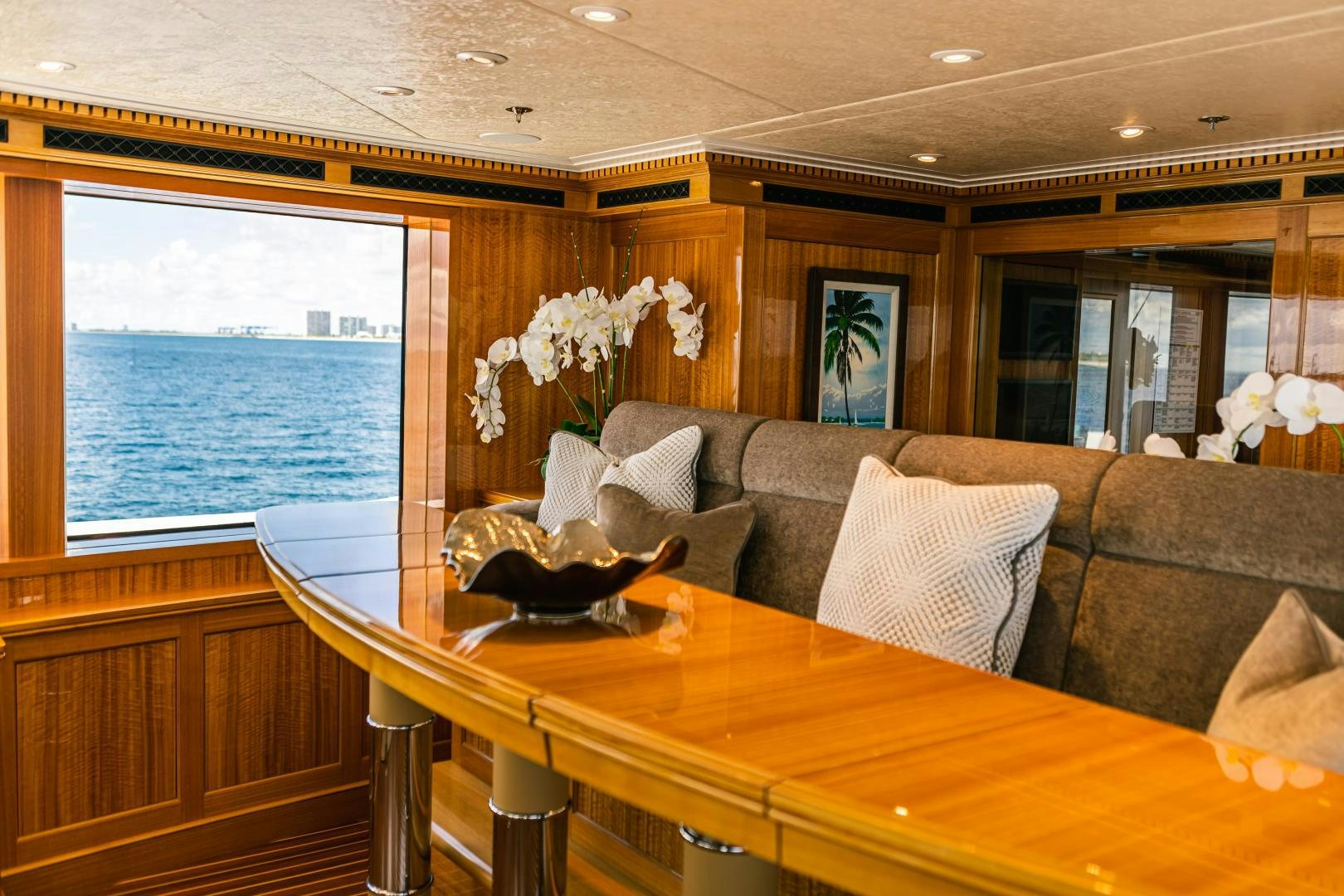 a living room with a couch and a table aboard GALLANT LADY Yacht for Sale
