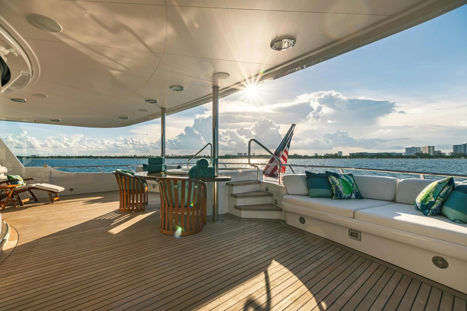 a room with a bed and a table and chairs aboard GALLANT LADY Yacht for Sale