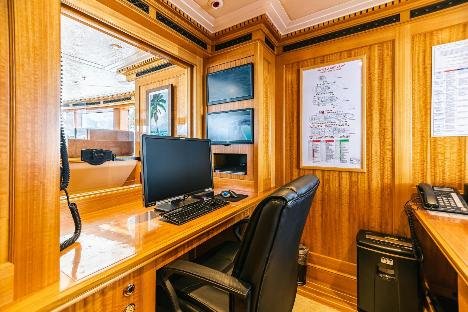 a computer on a desk aboard GALLANT LADY Yacht for Sale