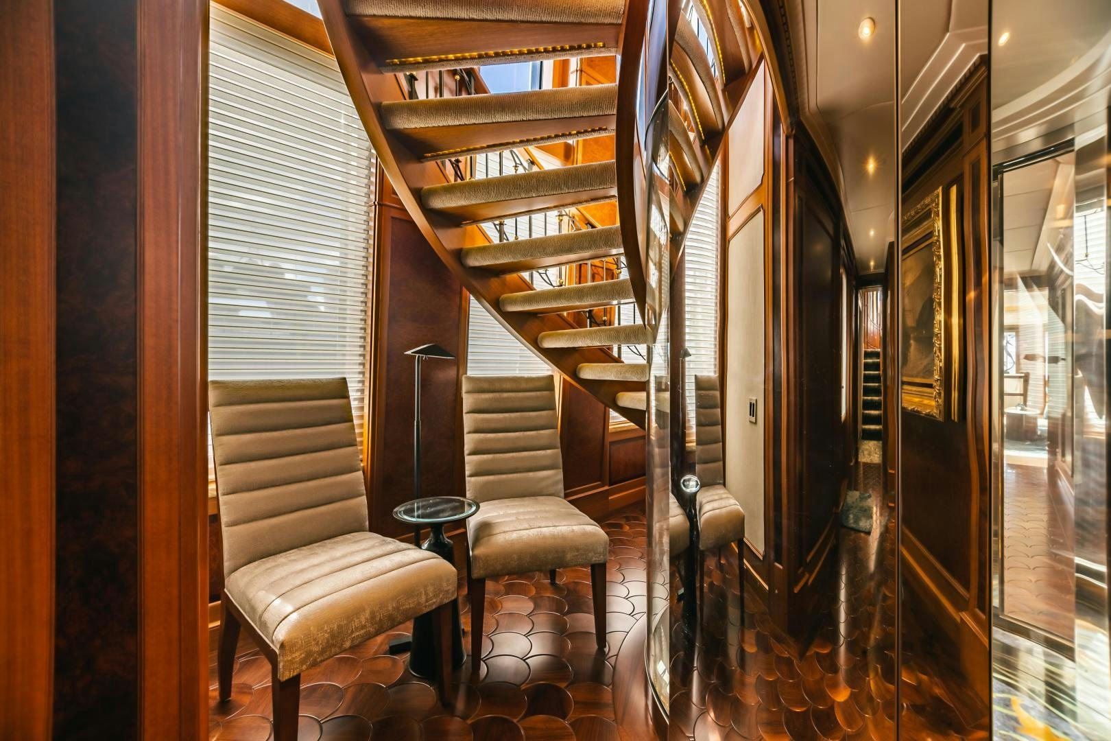 a room with a chair and a table and chairs aboard GALLANT LADY Yacht for Sale