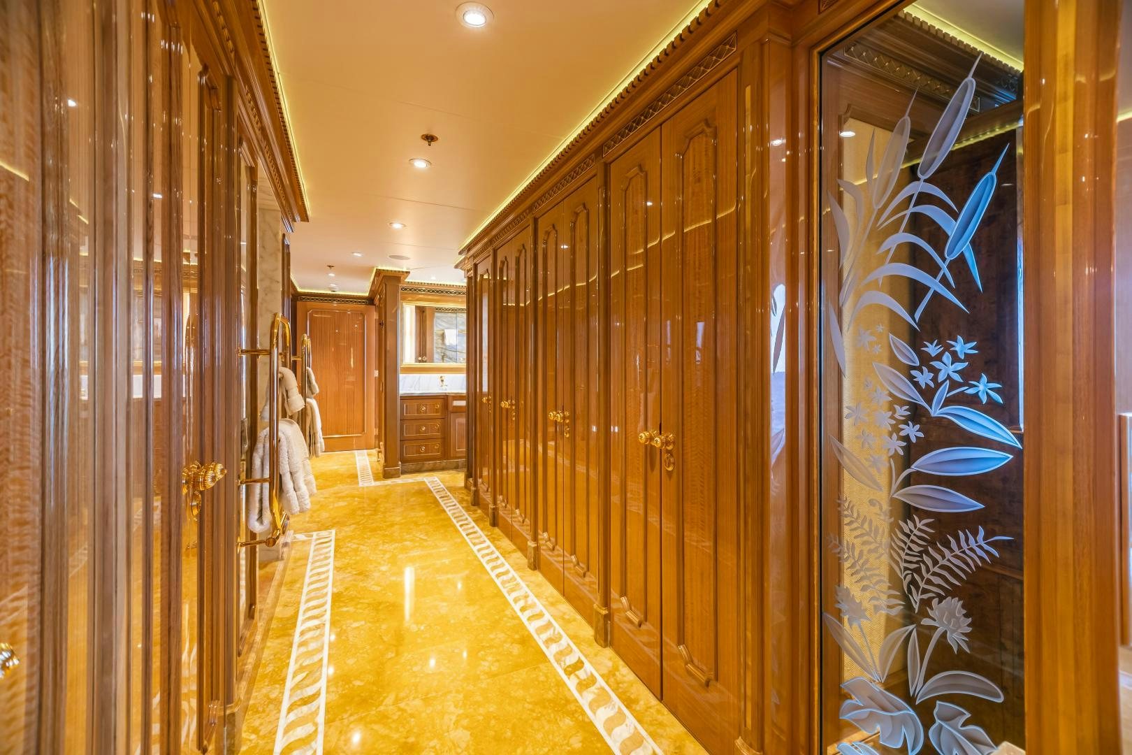 a hallway with a glass wall aboard GALLANT LADY Yacht for Sale