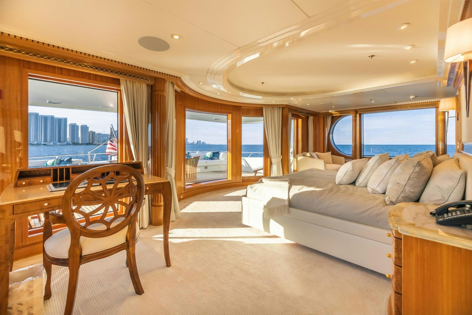 a bedroom with a bed and a couch aboard GALLANT LADY Yacht for Sale