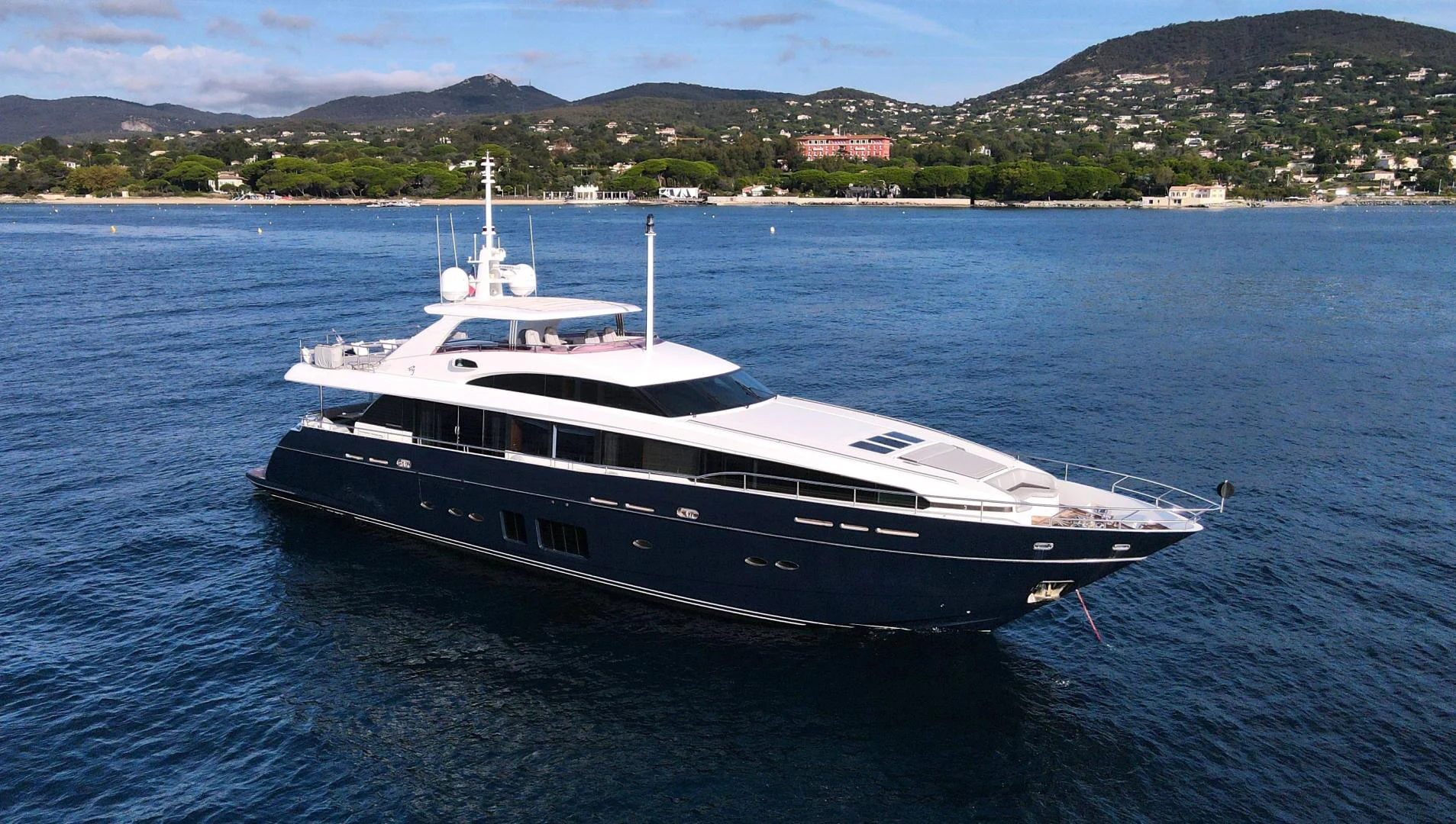 a large white boat in the water aboard M/Y FLY Yacht for Sale