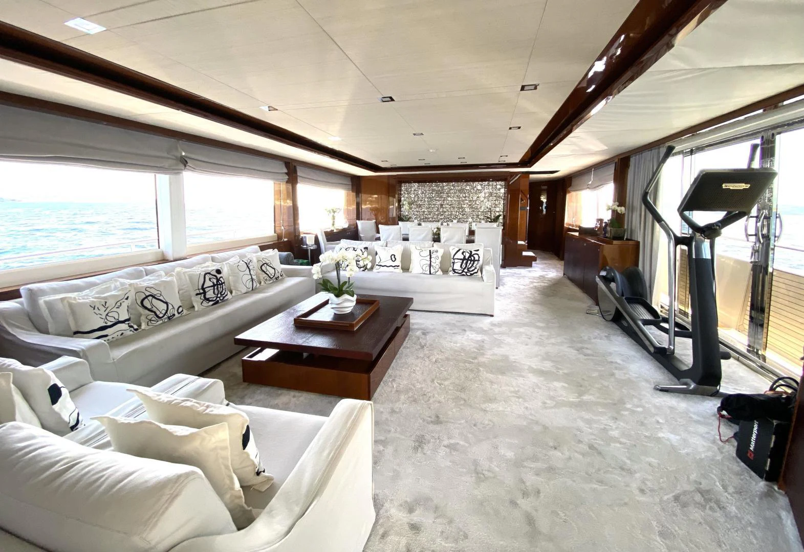 a room with a couch and a table aboard M/Y FLY Yacht for Sale