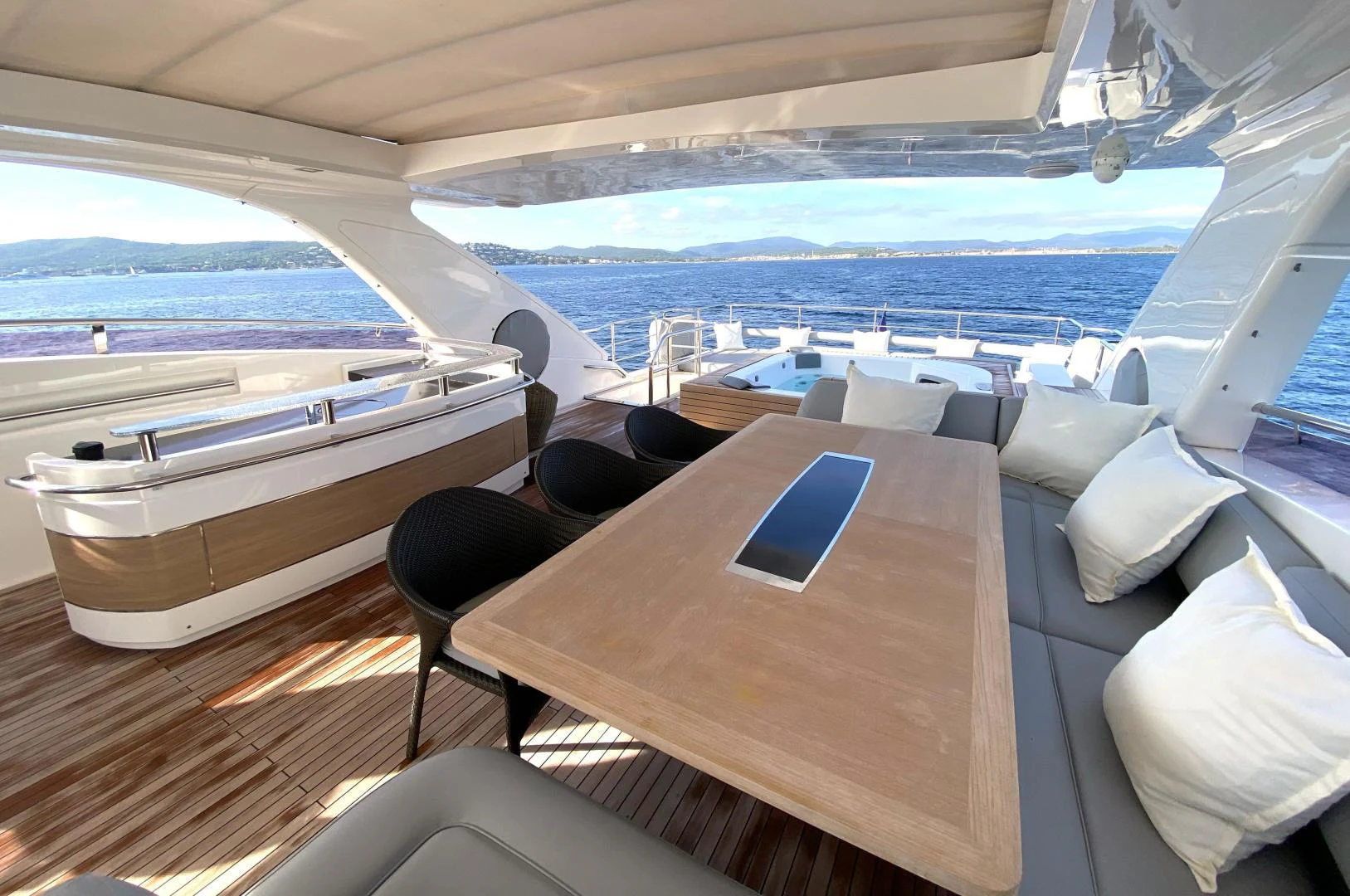 a room with a table and chairs aboard M/Y FLY Yacht for Sale