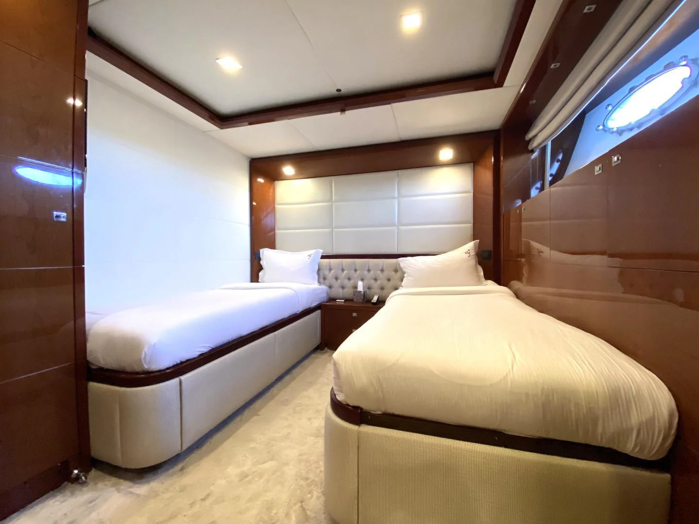 a room with two beds aboard M/Y FLY Yacht for Sale