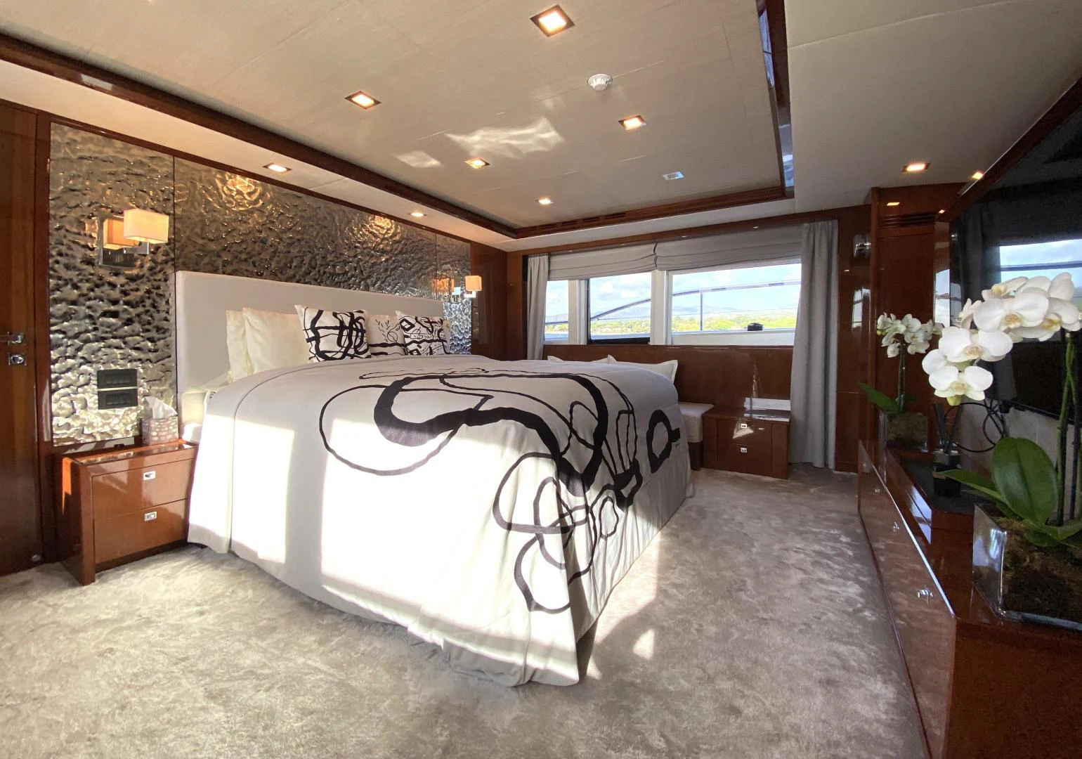 a bedroom with a large bed aboard M/Y FLY Yacht for Sale