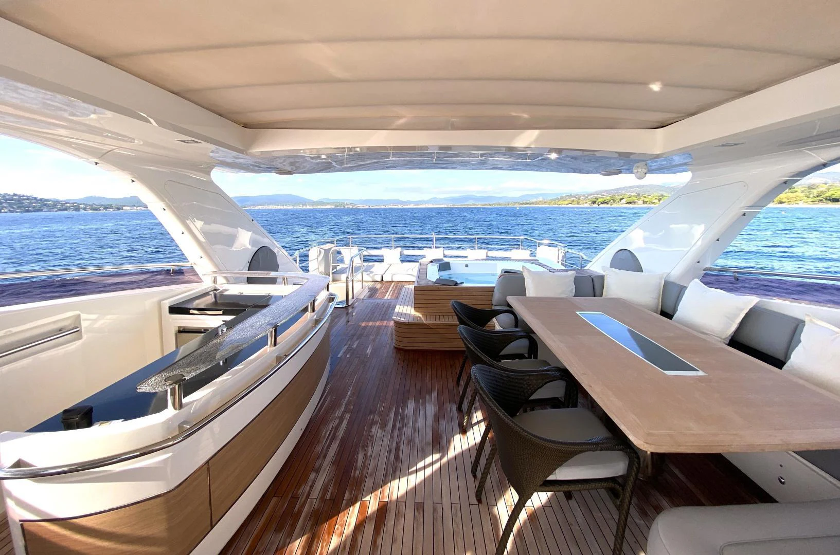 a deck with a view of the ocean and the deck aboard M/Y FLY Yacht for Sale