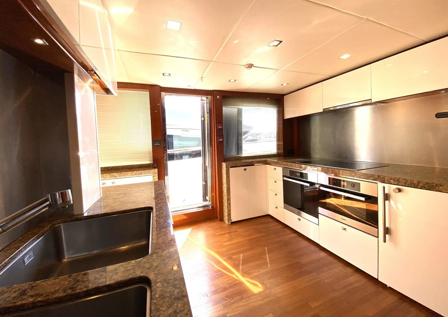 a kitchen with a large island aboard M/Y FLY Yacht for Sale