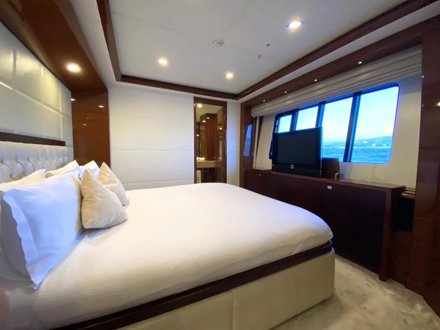 a bed with white sheets aboard M/Y FLY Yacht for Sale