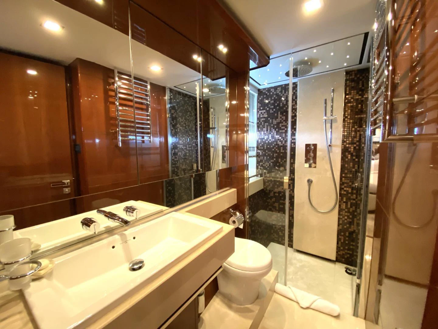 a bathroom with a glass shower aboard M/Y FLY Yacht for Sale
