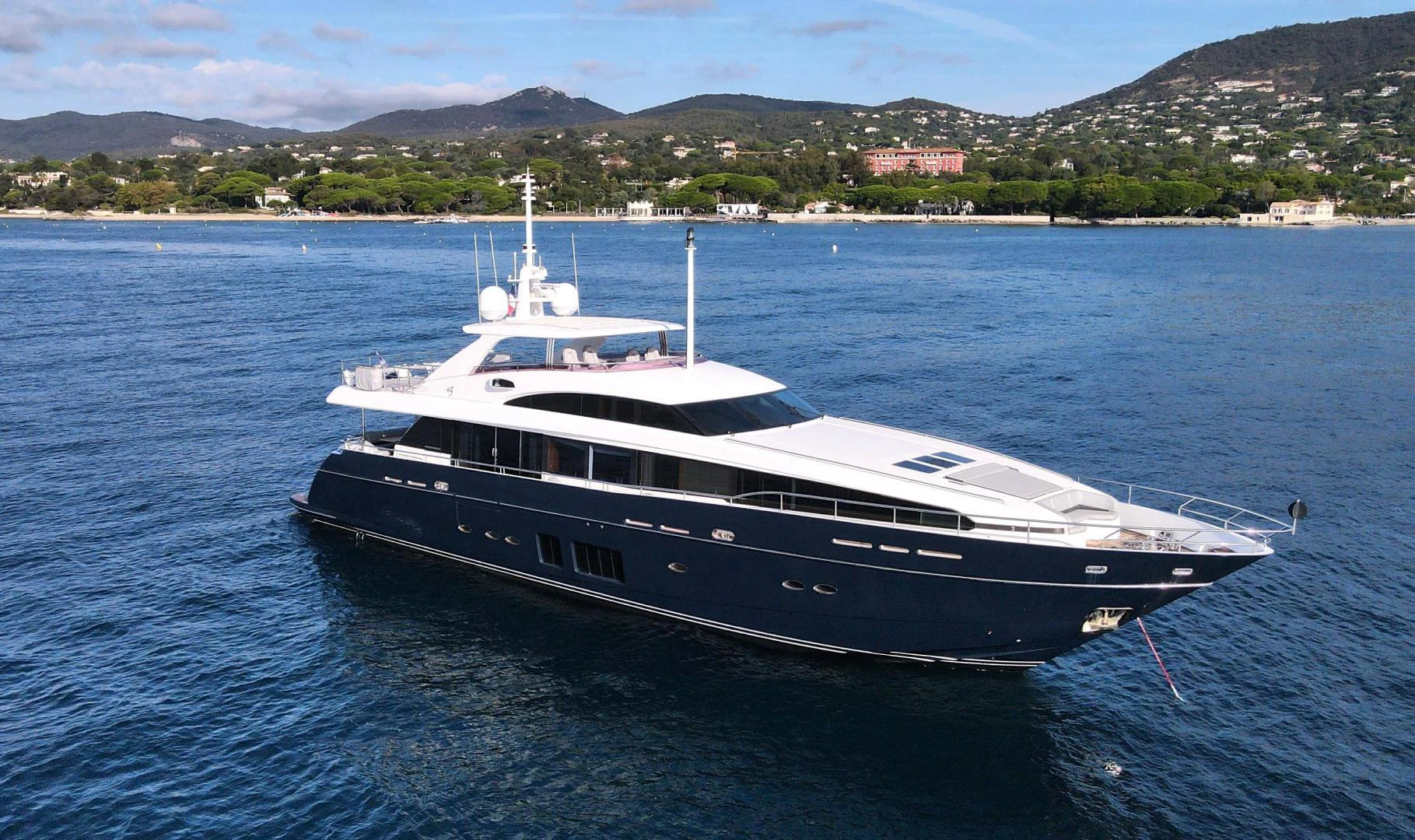 a large white boat in the water aboard M/Y FLY Yacht for Sale