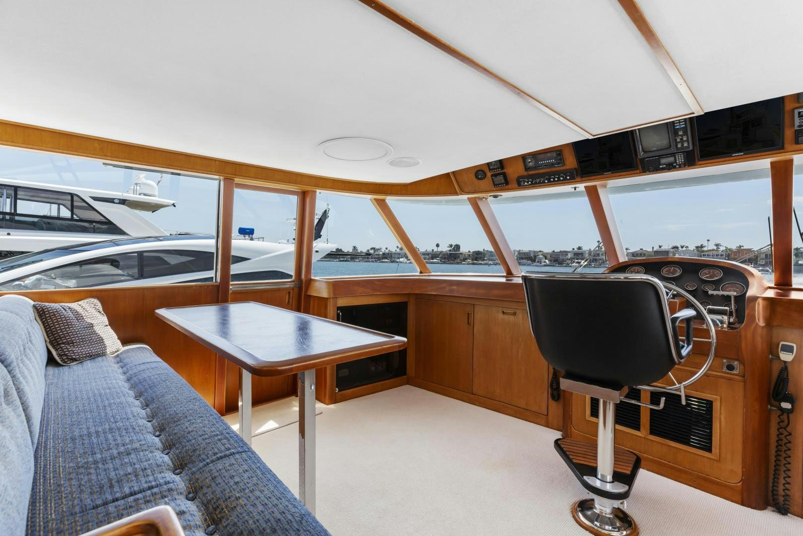 a room with a couch and a table and a chair aboard DON JUAN Yacht for Sale