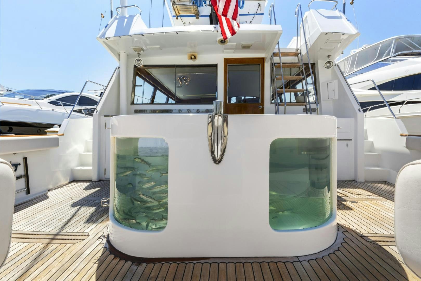 a small white boat on a deck aboard DON JUAN Yacht for Sale