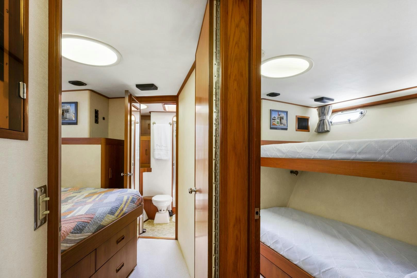 a room with a bed and a mirror aboard DON JUAN Yacht for Sale