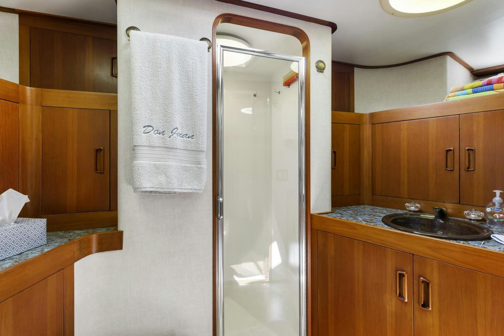 a bathroom with a shower unit and sink aboard DON JUAN Yacht for Sale