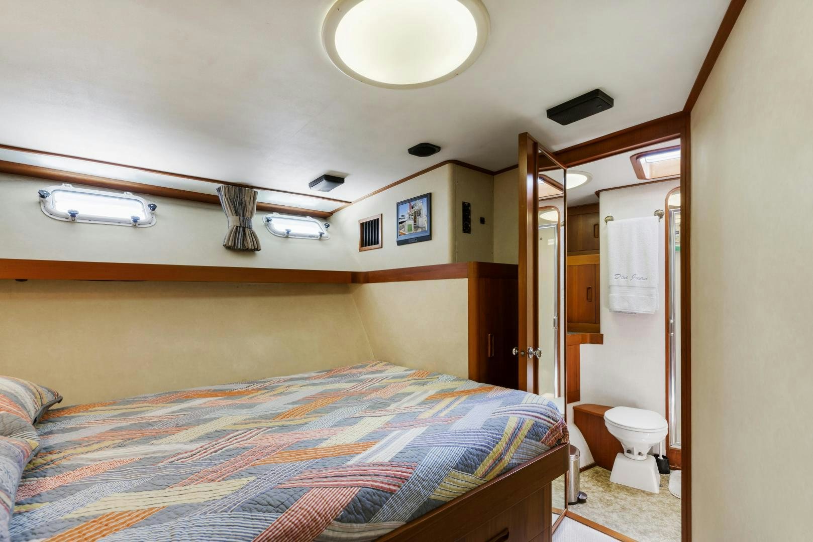 a bedroom with a bed and a closet aboard DON JUAN Yacht for Sale