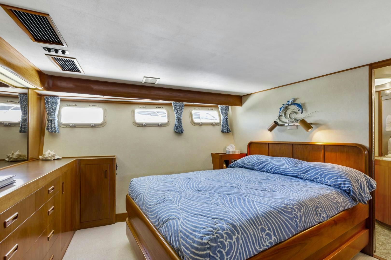 a bedroom with a bed and a desk aboard DON JUAN Yacht for Sale