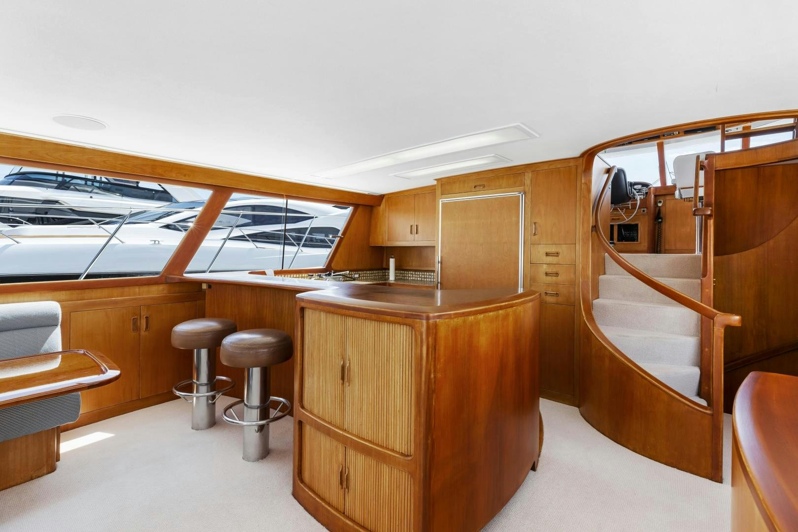 a kitchen with wooden cabinets aboard DON JUAN Yacht for Sale