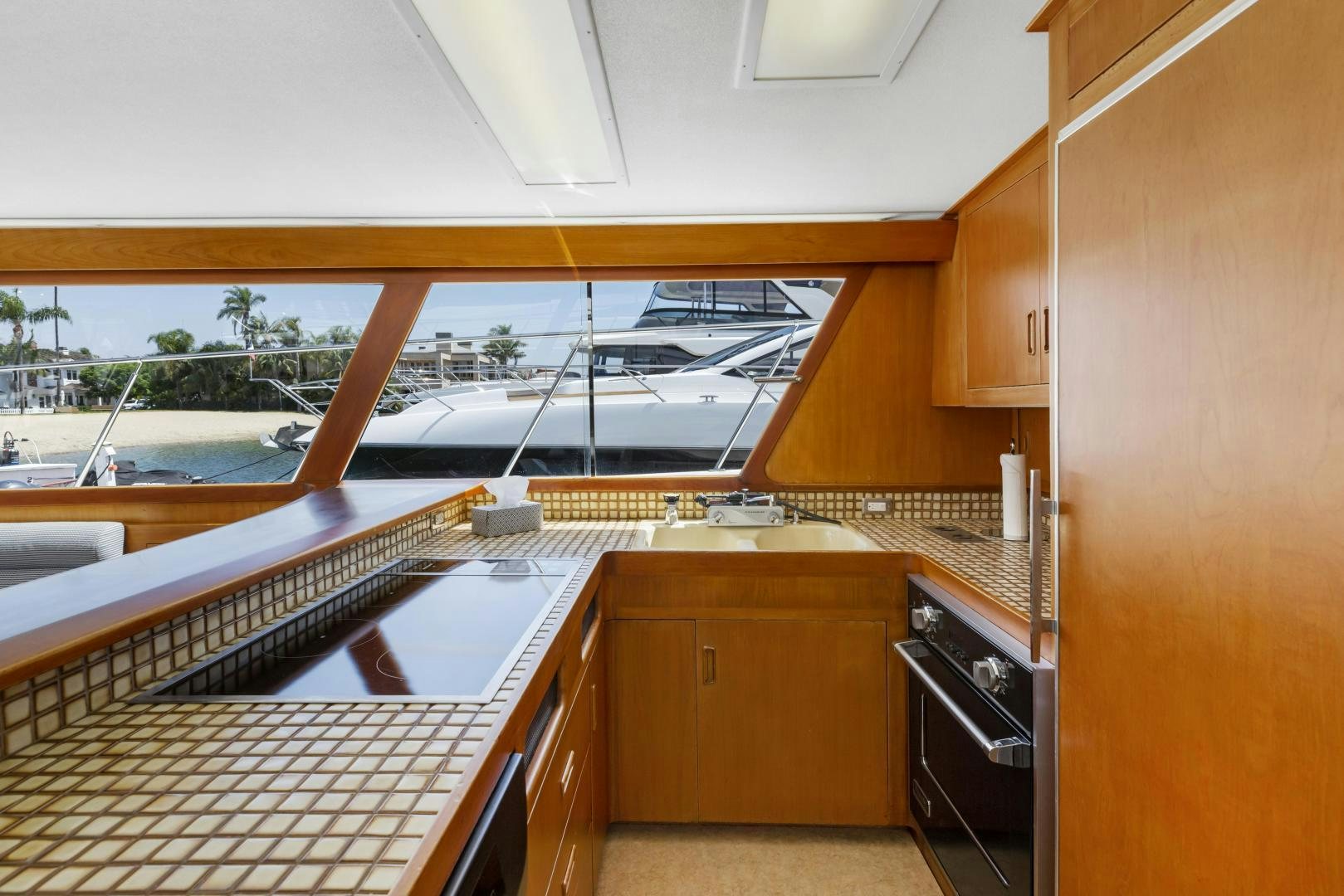 a kitchen with wooden cabinets aboard DON JUAN Yacht for Sale