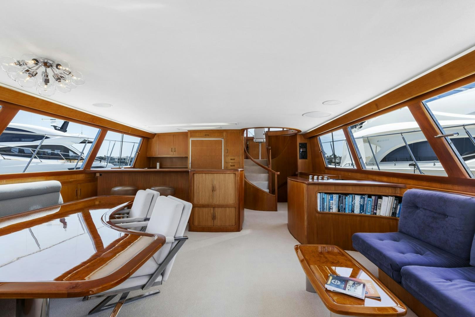 a room with a couch and a table and a chair aboard DON JUAN Yacht for Sale