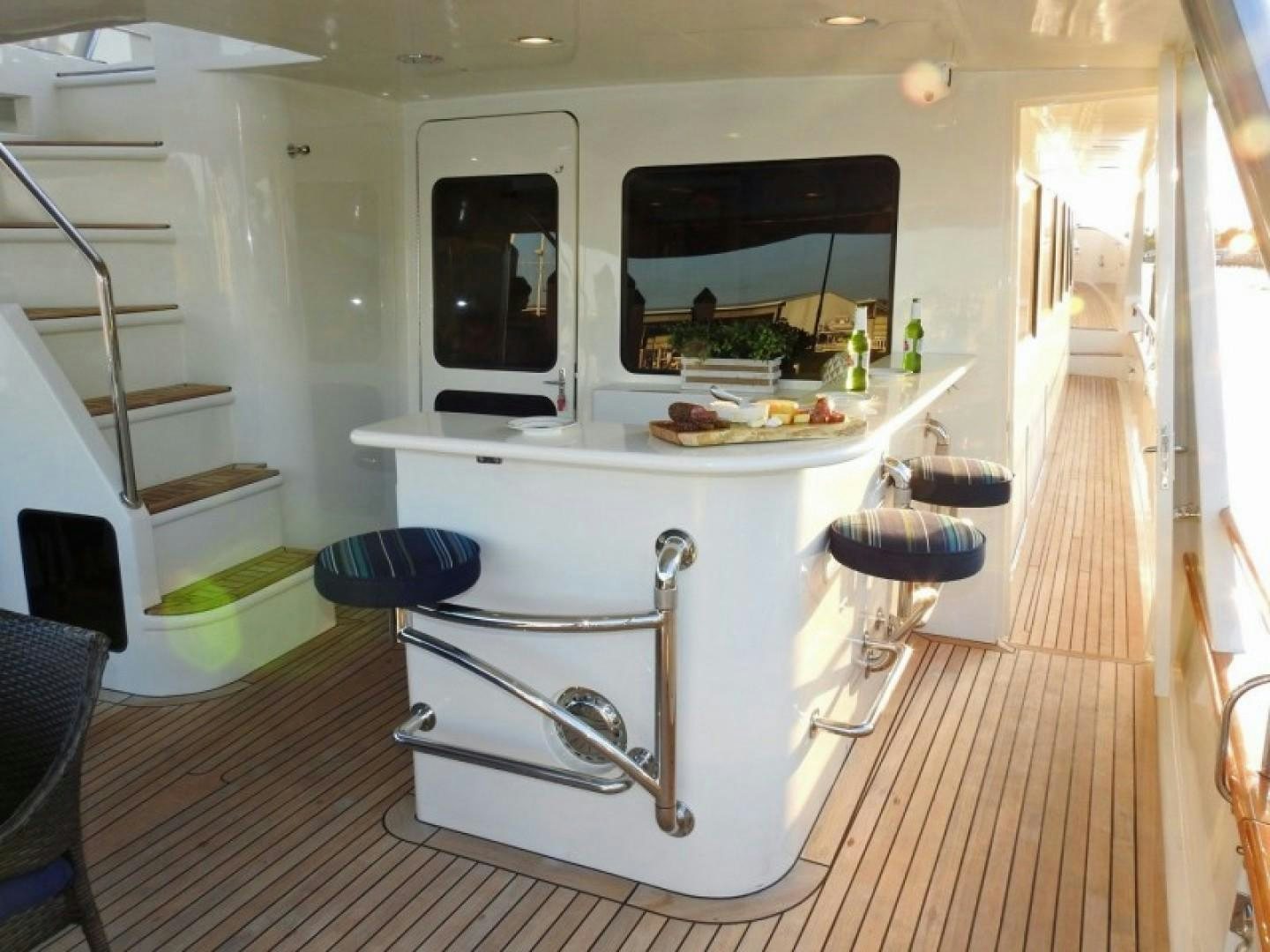 a kitchen with a table and chairs aboard AGAVE Yacht for Sale