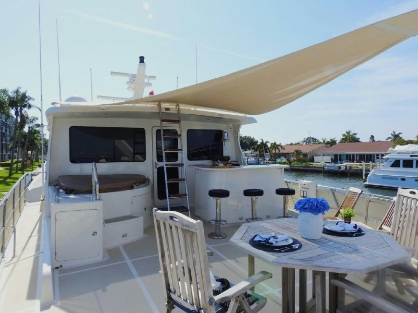 a white boat on a deck aboard AGAVE Yacht for Sale