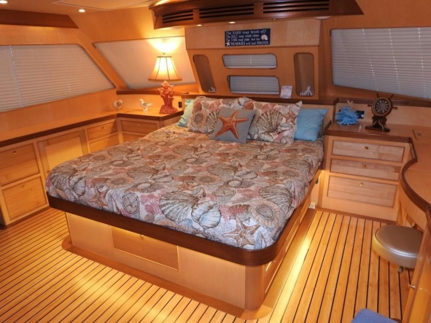 a bed in a room aboard AGAVE Yacht for Sale