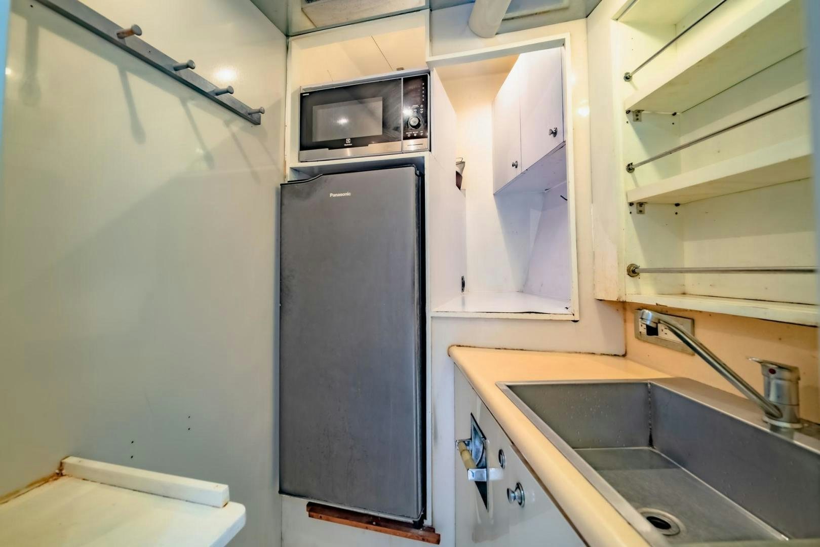 a kitchen with a microwave oven aboard DOUBLEYOU Yacht for Sale