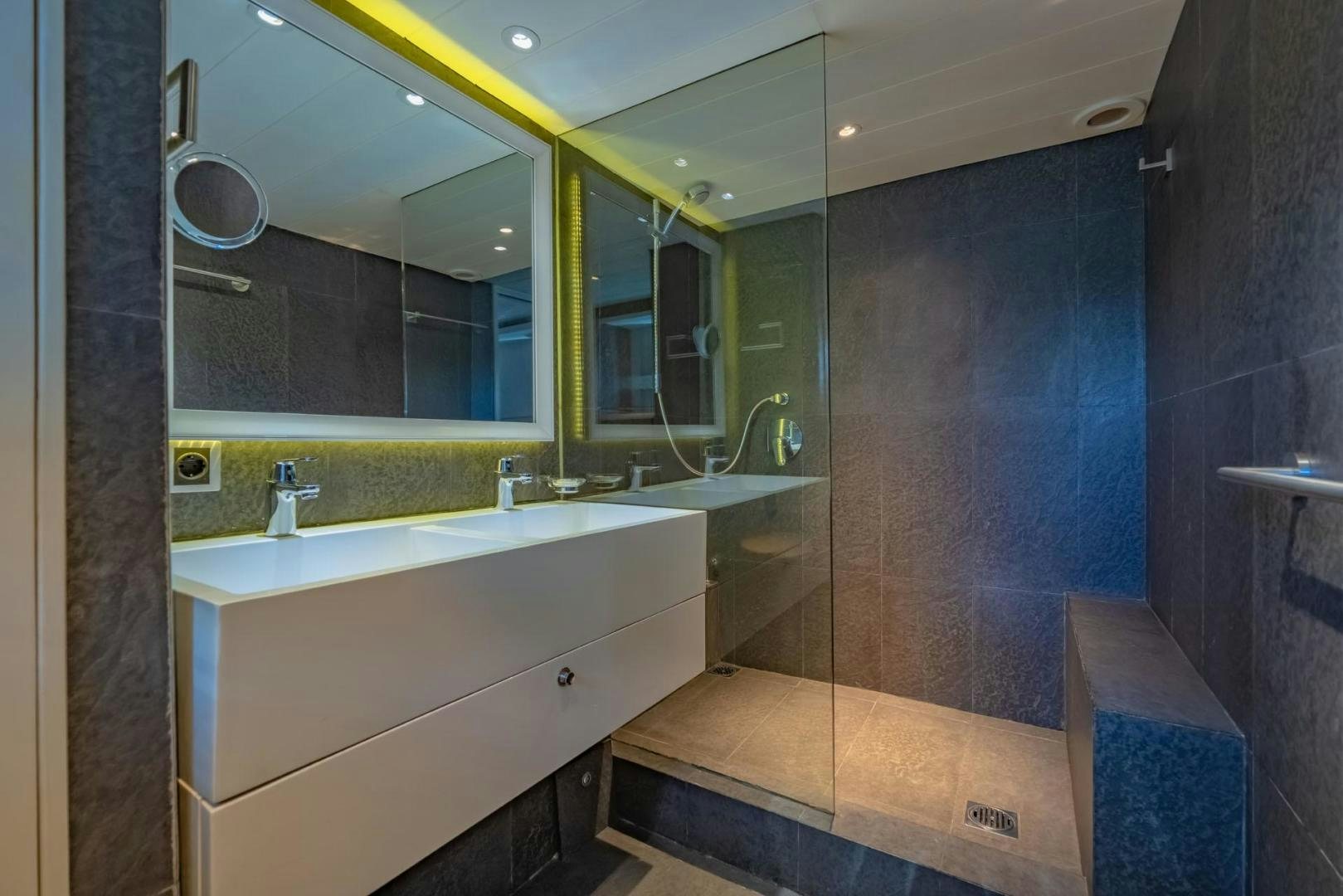 a bathroom with a large mirror aboard DOUBLEYOU Yacht for Sale