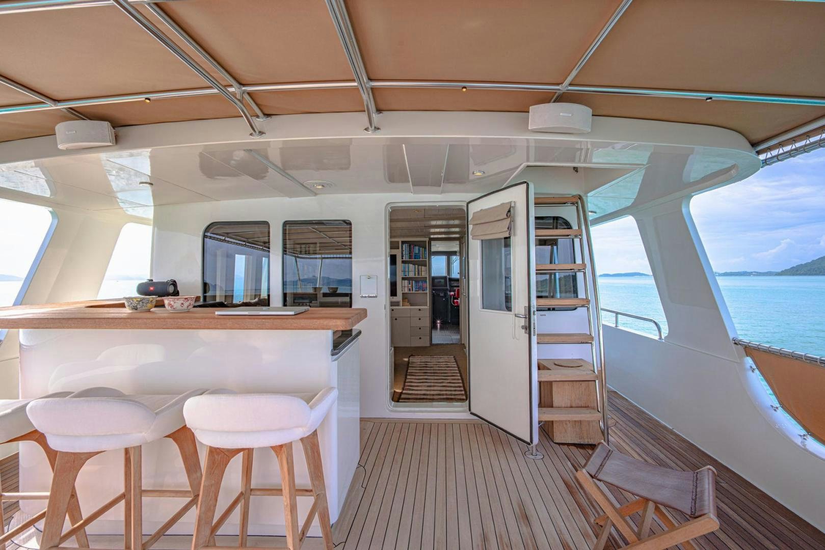 a room with a table and chairs aboard DOUBLEYOU Yacht for Sale