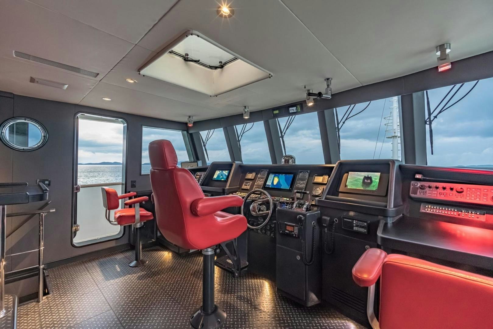 inside of a vehicle with a large window and a red seat aboard DOUBLEYOU Yacht for Sale