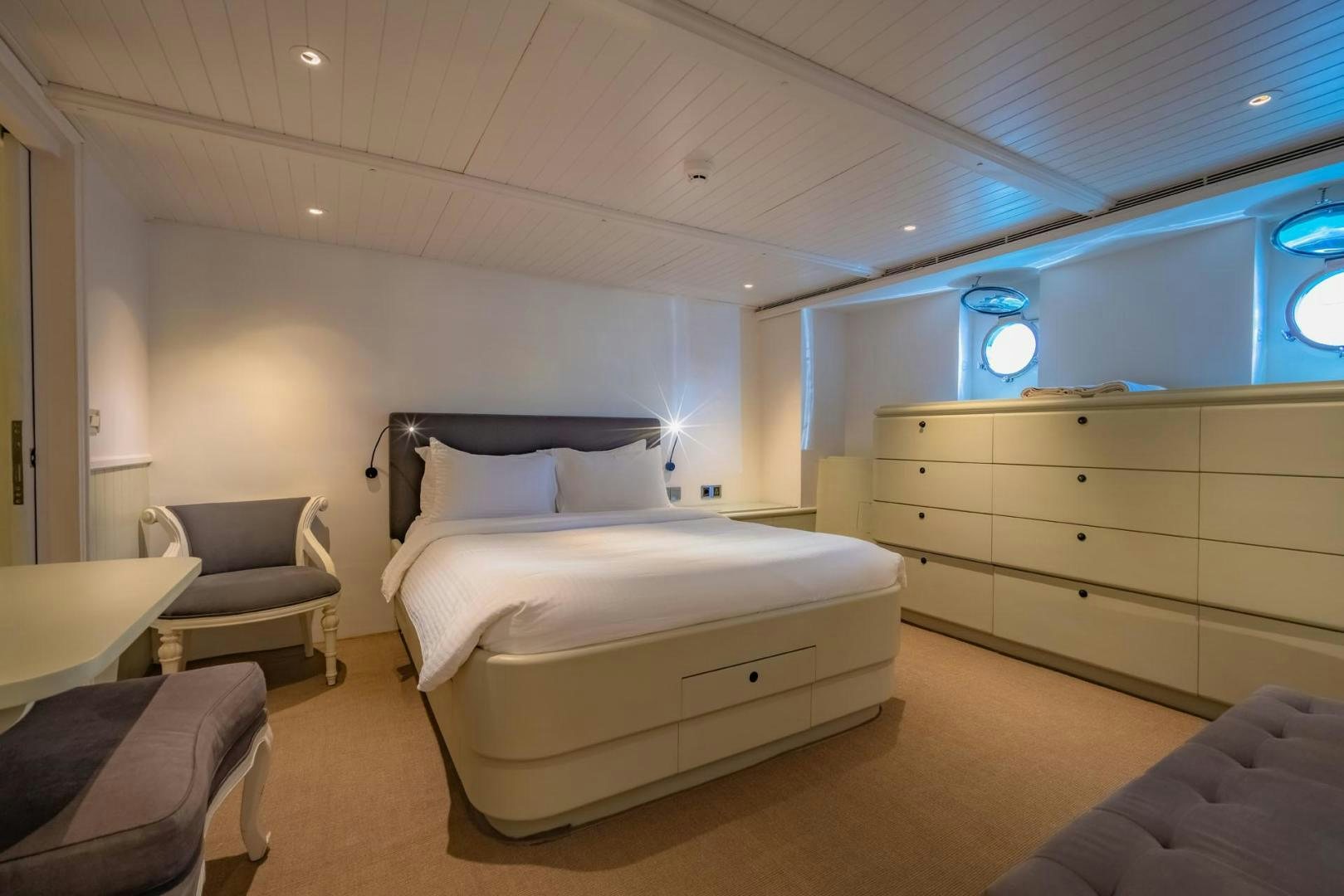 a room with a bed and a desk aboard DOUBLEYOU Yacht for Sale