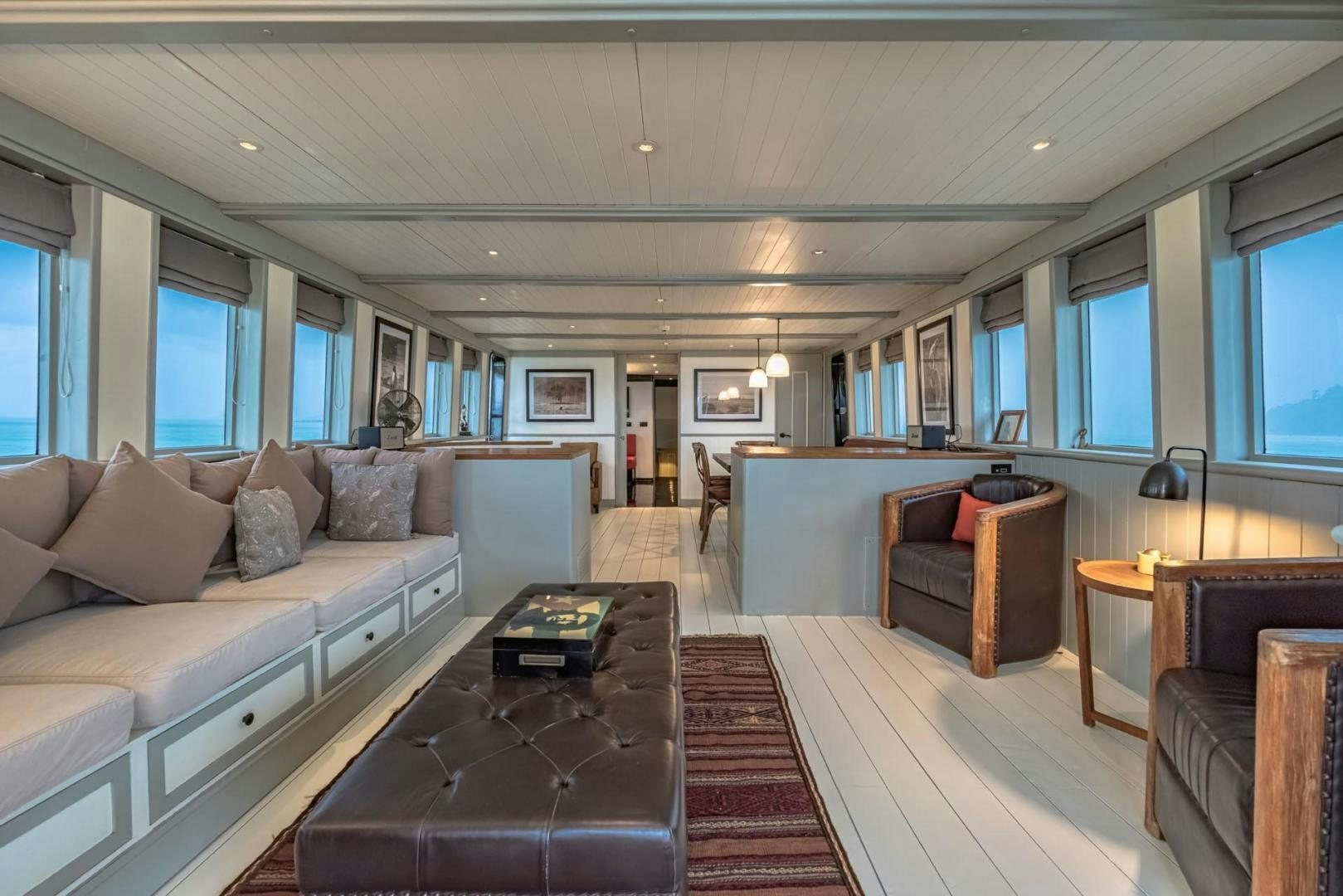 a living room with a couch and a coffee table aboard DOUBLEYOU Yacht for Sale