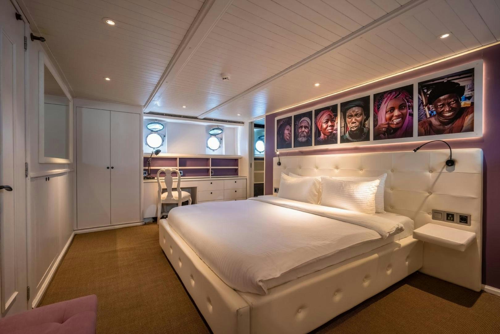 a room with a bed and a desk aboard DOUBLEYOU Yacht for Sale